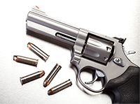 https://www.atf.gov/sites/default/files/media/2015/07/image_of_gun_with_bullets_on_steel_000016146459.jpg