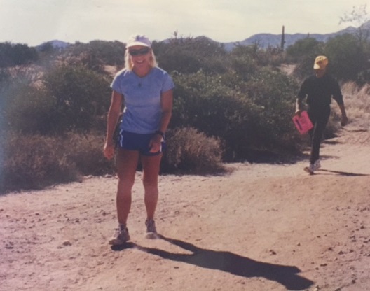An image of Nicole Strong walks on desert trail