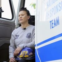 Cindy sitting in an ATF vehicle