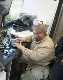 Theron typing on a laptop