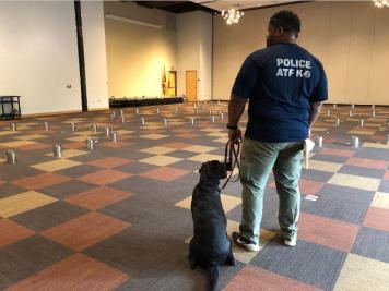 Special Agent Canine Handler and his K-9 pose for a picture as they prepare for training drills.