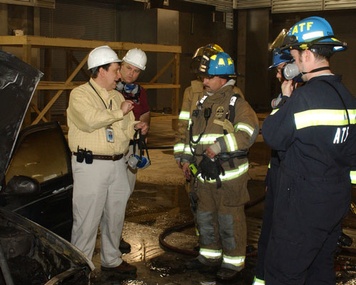 Joseph Bertoni, local firefighters and ATF Certified Fire Investigators investigate a fire incident