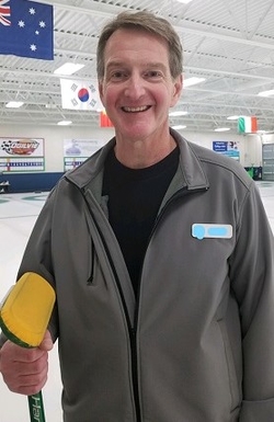 Ed standing on an ice rink