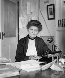 Hopley sitting at a desk